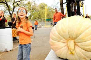 With a pumpkin weighing 1,061 pounds, seven-year-old Audry Warren wins the Open Category in the Giant Pumpkin Contest at the 12th Annual Auburn Community Festival, beating out her nearest opponent by 173 pounds and shattering the previous record. (Auburn CA, 2008)