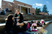 Megan Doyle, 14, left, and Aurelie Moilin, 14, eat lunch on the steps of the amphitheater at Roseville High School. The outdoor theater was donated by the class of 1931. (Roseville CA, 2008)